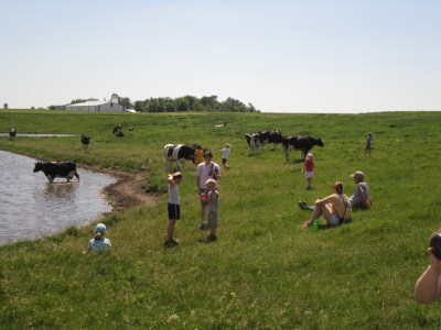 Girl Scouts relaxing in pasture